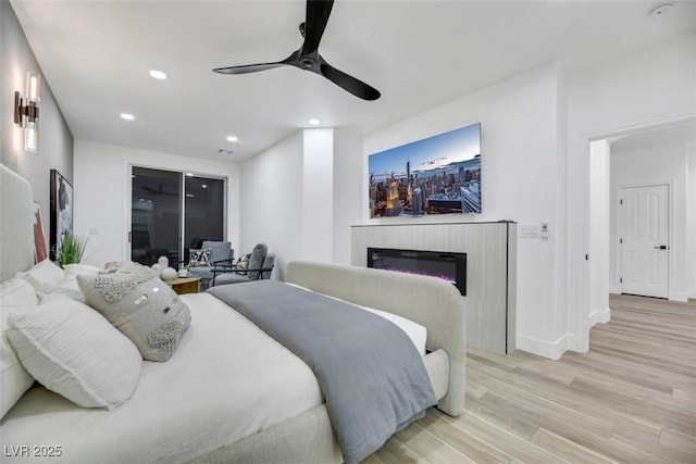 bedroom featuring light hardwood / wood-style flooring and ceiling fan