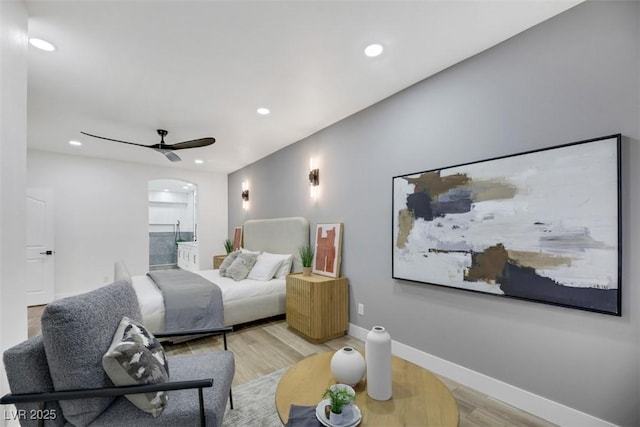 bedroom with ceiling fan and light hardwood / wood-style floors