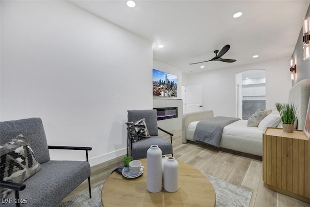 bedroom with ceiling fan and light wood-type flooring