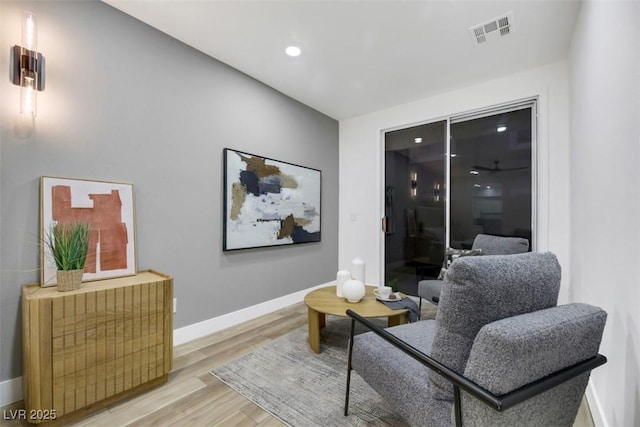 sitting room featuring light hardwood / wood-style flooring