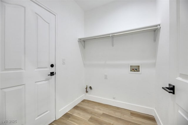 laundry room featuring washer hookup, light hardwood / wood-style floors, and gas dryer hookup