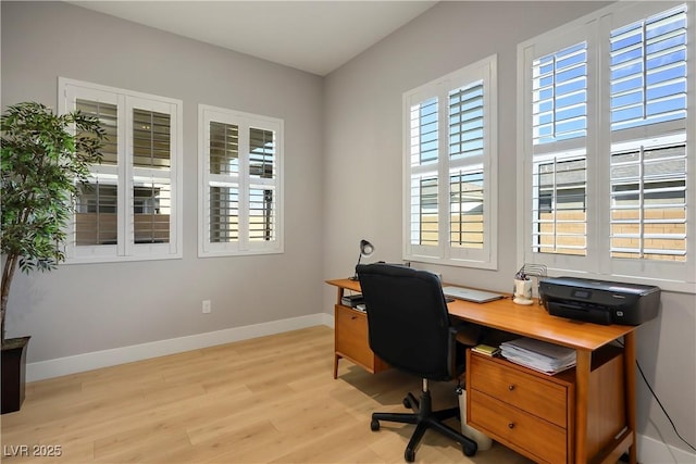 office with light wood-type flooring