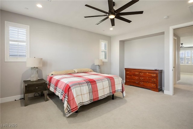 bedroom with light carpet and ceiling fan