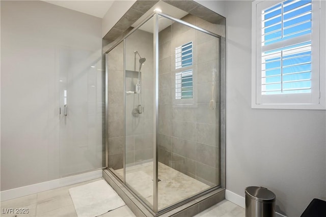 bathroom featuring tile patterned flooring and a shower with shower door