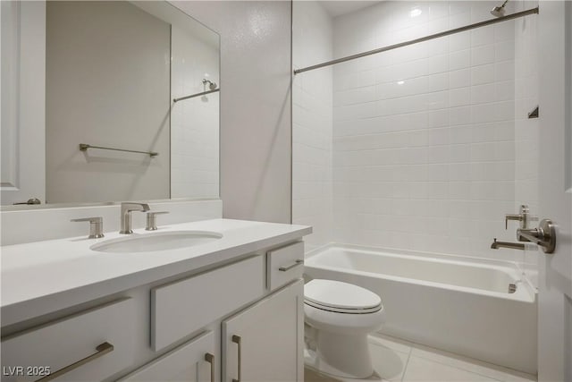 full bathroom with tile patterned flooring, vanity, toilet, and tiled shower / bath combo