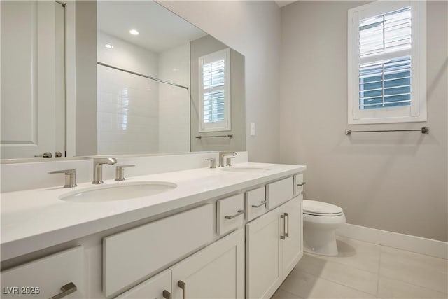 bathroom with walk in shower, tile patterned floors, vanity, and toilet