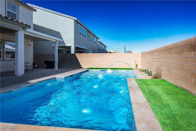 view of swimming pool with pool water feature