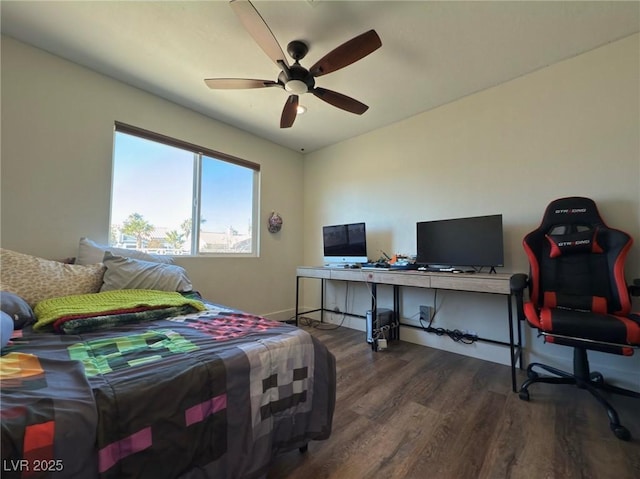 bedroom with ceiling fan and dark hardwood / wood-style flooring