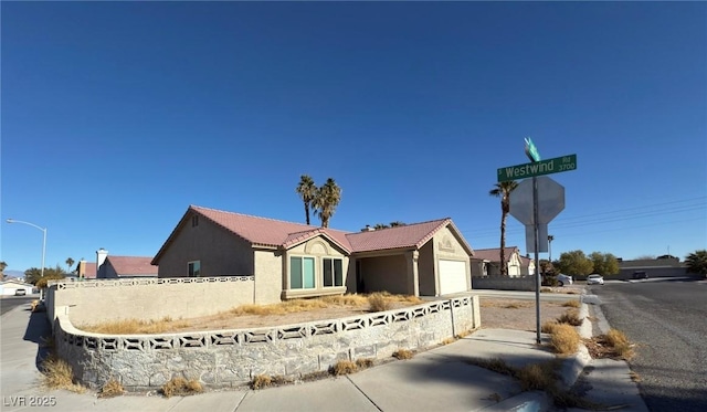 view of front of home with a garage