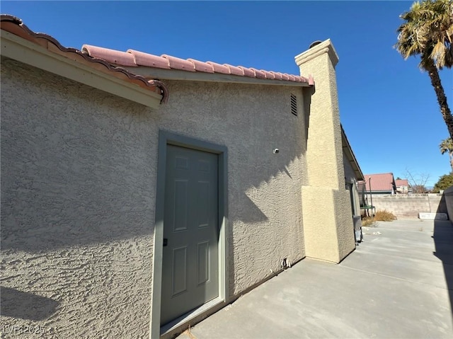 entrance to property with a patio area