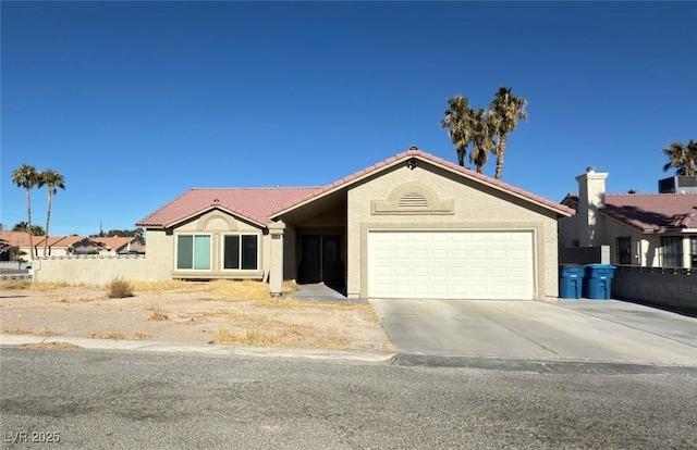 ranch-style home with cooling unit and a garage