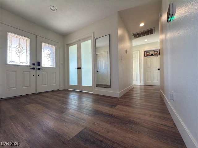 entrance foyer featuring french doors and dark wood-type flooring