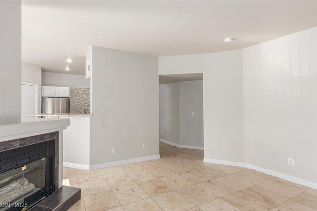 unfurnished living room with a fireplace