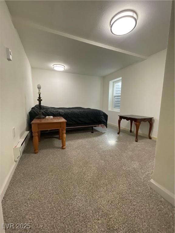 bedroom with a baseboard heating unit