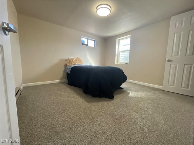 bedroom featuring carpet flooring and a baseboard heating unit