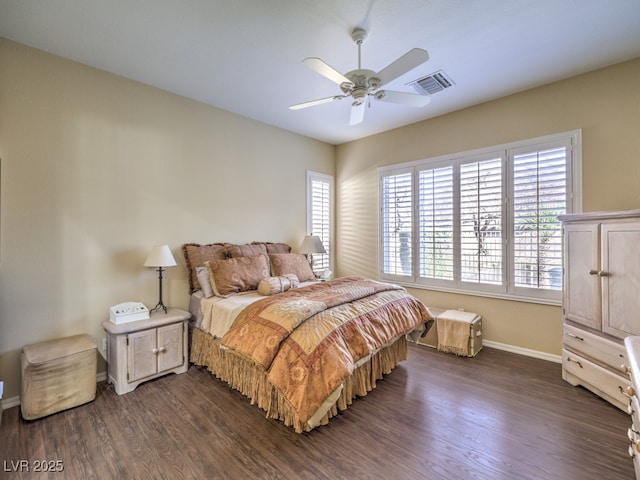 bedroom featuring ceiling fan and dark hardwood / wood-style floors