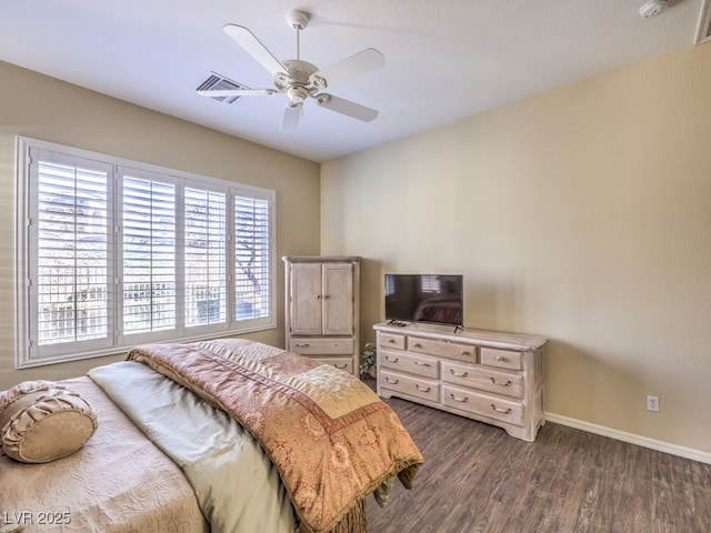 bedroom with dark wood-type flooring and ceiling fan