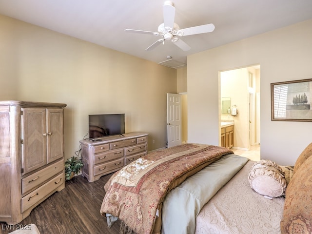 bedroom featuring ceiling fan, dark hardwood / wood-style flooring, and ensuite bathroom