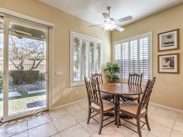 tiled dining area with ceiling fan