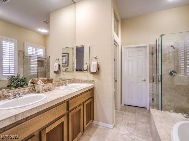 bathroom with shower with separate bathtub, tile patterned floors, and vanity