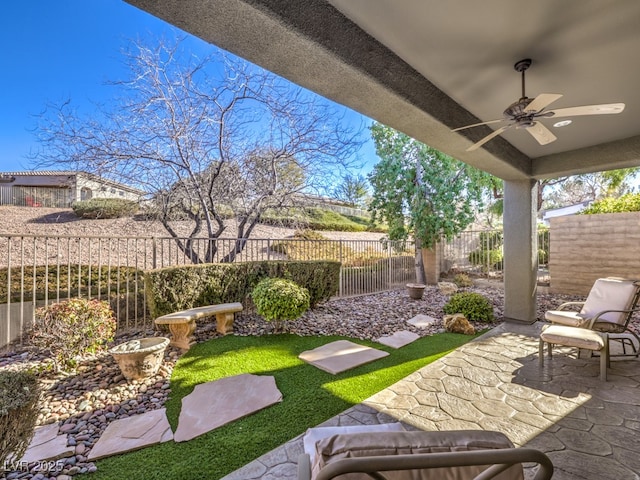 view of patio featuring ceiling fan