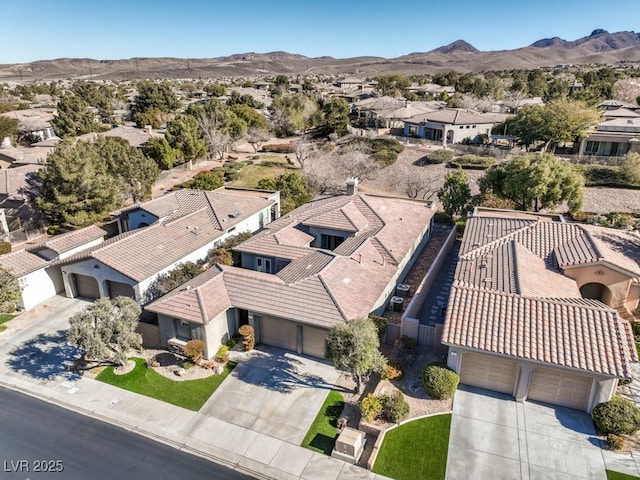 birds eye view of property featuring a mountain view