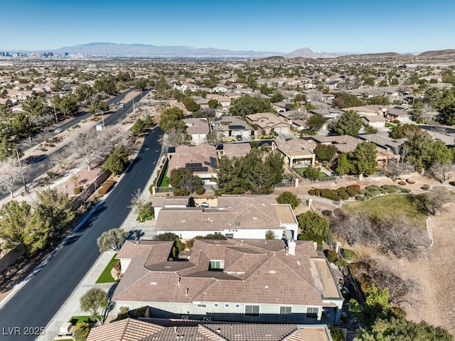 birds eye view of property with a mountain view