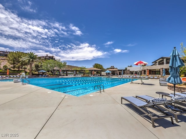 view of swimming pool featuring a patio area