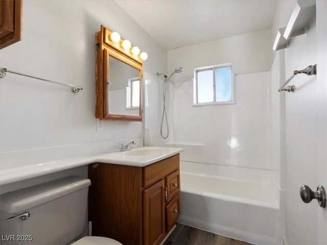 full bathroom featuring toilet, shower / tub combination, vanity, and hardwood / wood-style floors