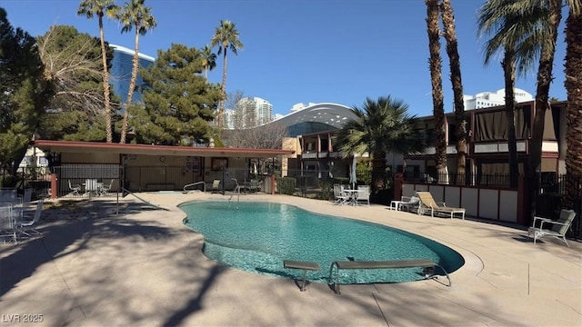 view of swimming pool featuring a patio area