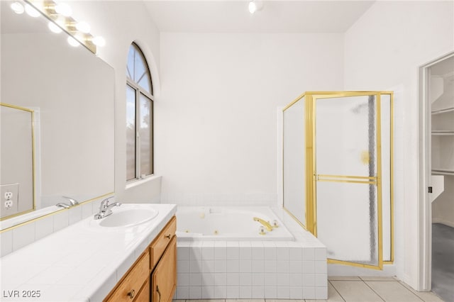 bathroom with independent shower and bath, tile patterned flooring, and vanity