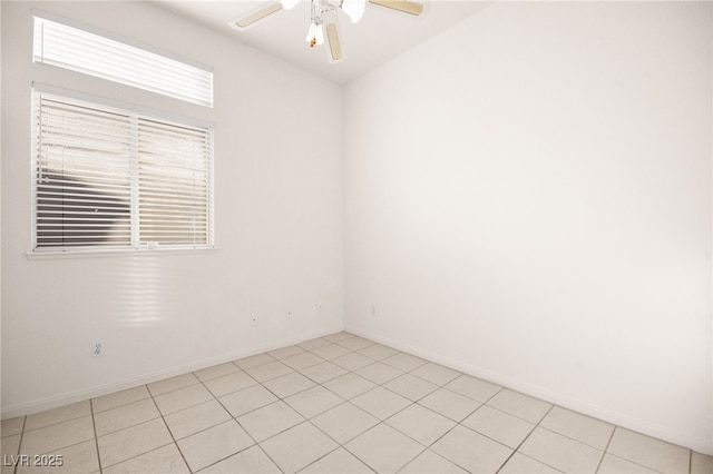 unfurnished room with ceiling fan and light tile patterned floors