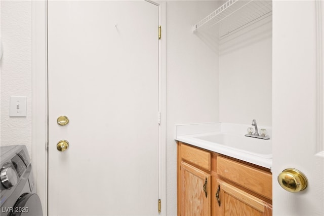 laundry room with washer / clothes dryer and sink