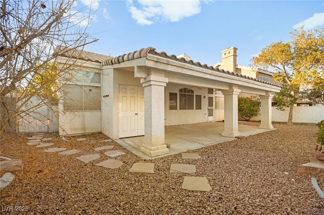 back of property with a patio area