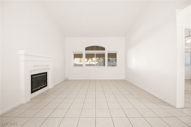 unfurnished living room featuring a fireplace and light tile patterned floors