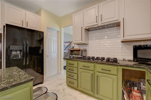 kitchen featuring black appliances, white cabinetry, dark stone countertops, and decorative backsplash