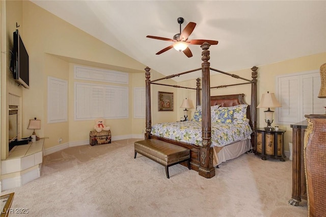 carpeted bedroom featuring lofted ceiling and ceiling fan