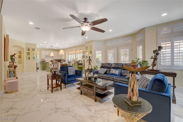 living room with french doors and ceiling fan