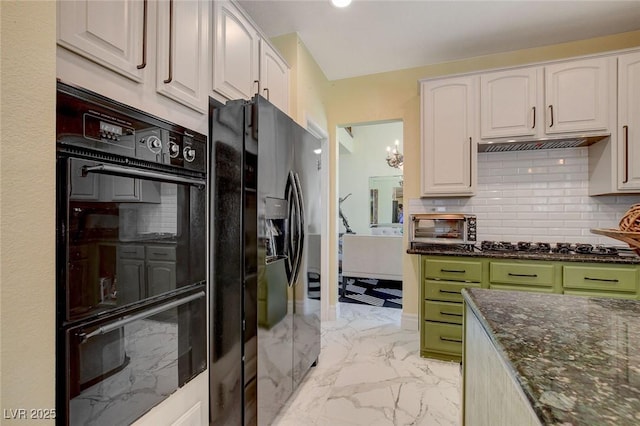 kitchen featuring white cabinets, a notable chandelier, dark stone countertops, and black appliances