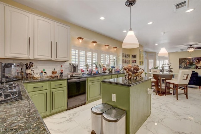 kitchen featuring white cabinets, a center island, green cabinets, black dishwasher, and hanging light fixtures