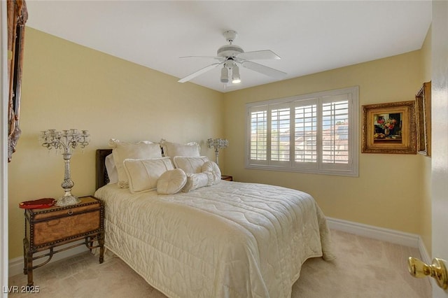 bedroom with ceiling fan and light colored carpet