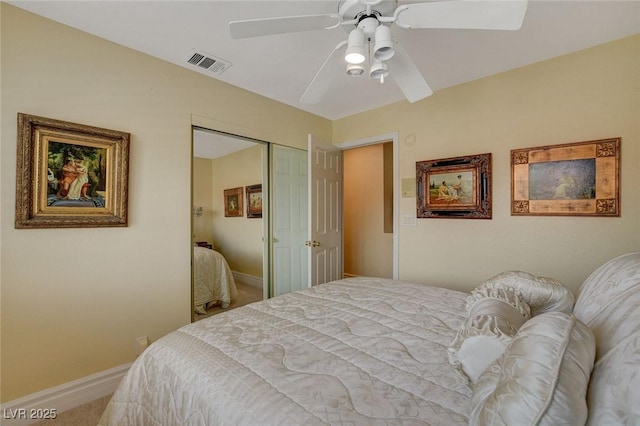 carpeted bedroom with a closet and ceiling fan