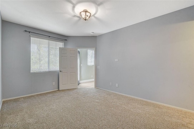 empty room with light colored carpet