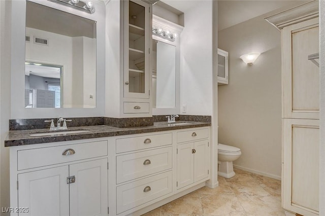 bathroom with vanity and toilet