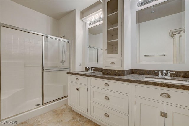 bathroom with an enclosed shower and vanity