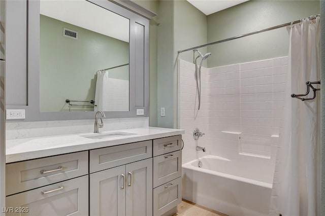 bathroom with shower / bath combination with curtain and vanity