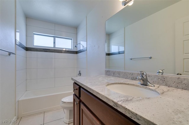 full bathroom with toilet, vanity, tile patterned floors, and tiled shower / bath combo