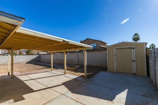 view of patio / terrace with a storage unit