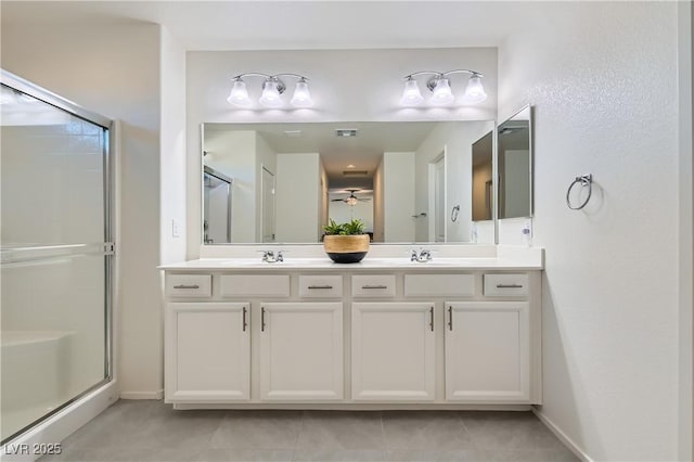 bathroom featuring ceiling fan, vanity, an enclosed shower, and tile patterned floors