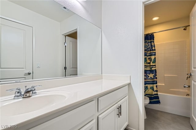 full bathroom featuring tile patterned flooring, shower / bath combo with shower curtain, vanity, and toilet